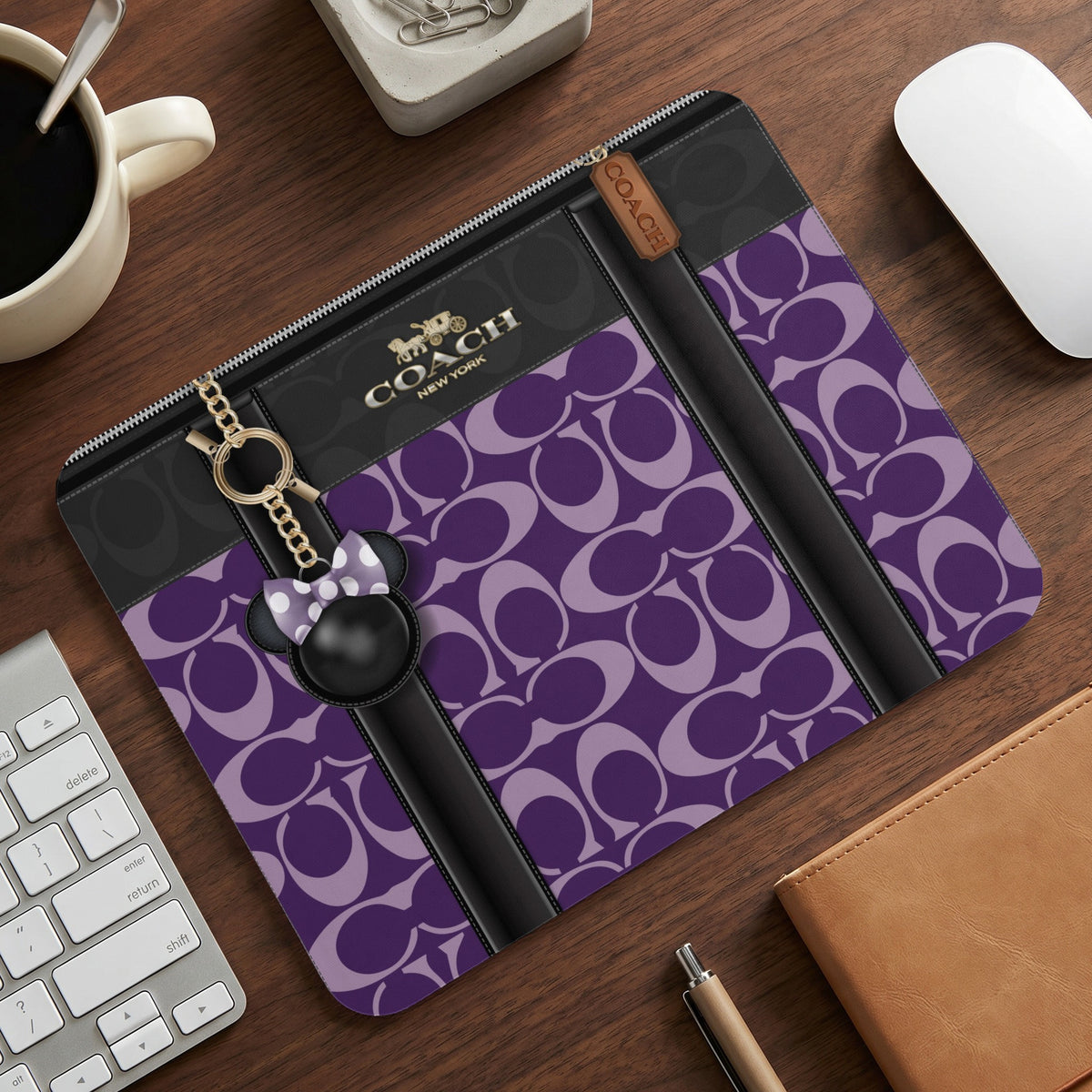 Coach C monogram mousepad with a Minnie Mouse charm and keychain.