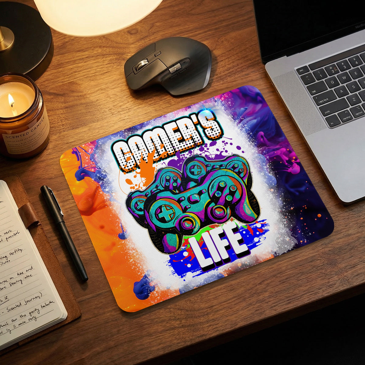 Colorful mousepad with the text Gamer's Life and controller graphics, on a wooden desk.