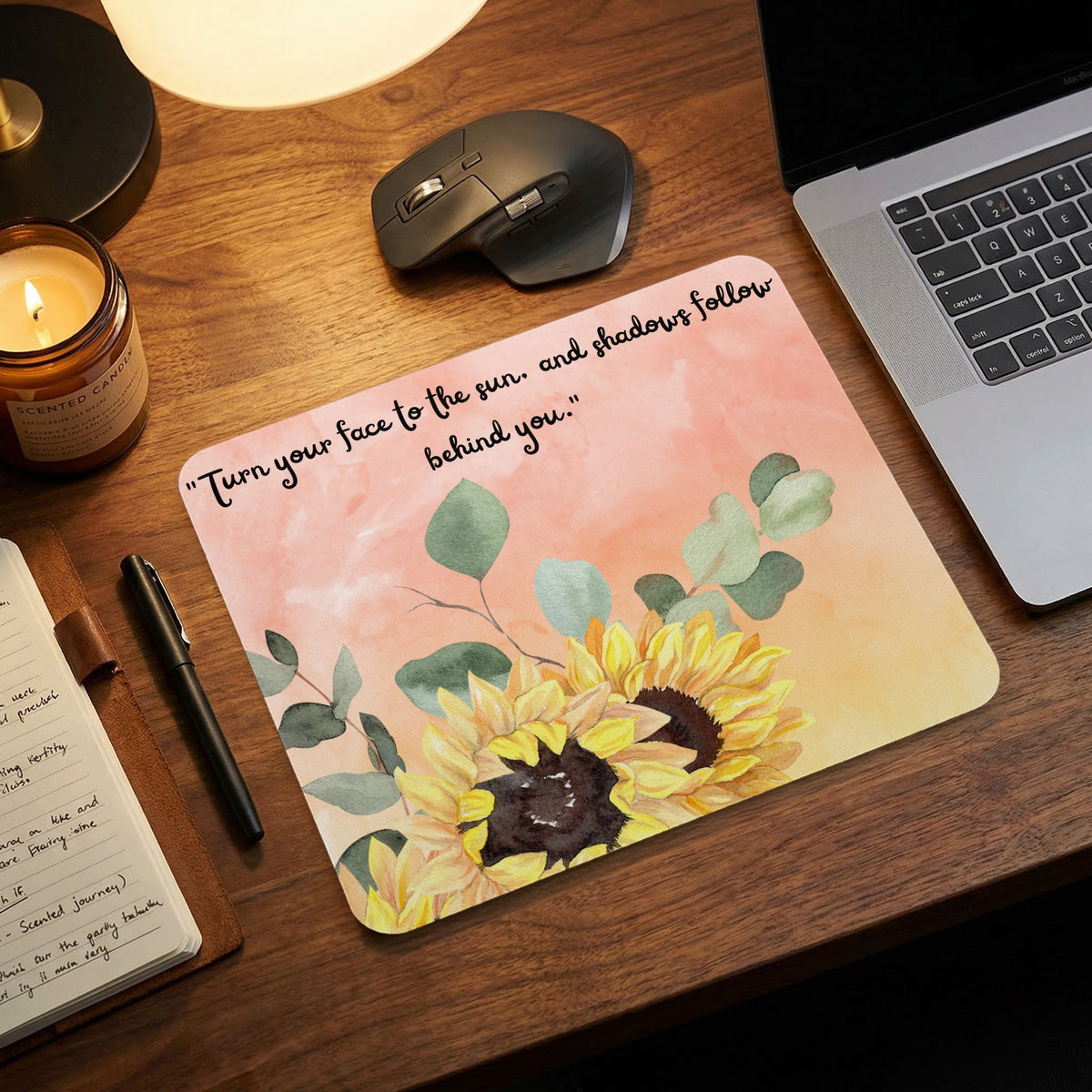 Mousepad with sunflowers and text "Turn your face to the sun. and shadows follow behind you."