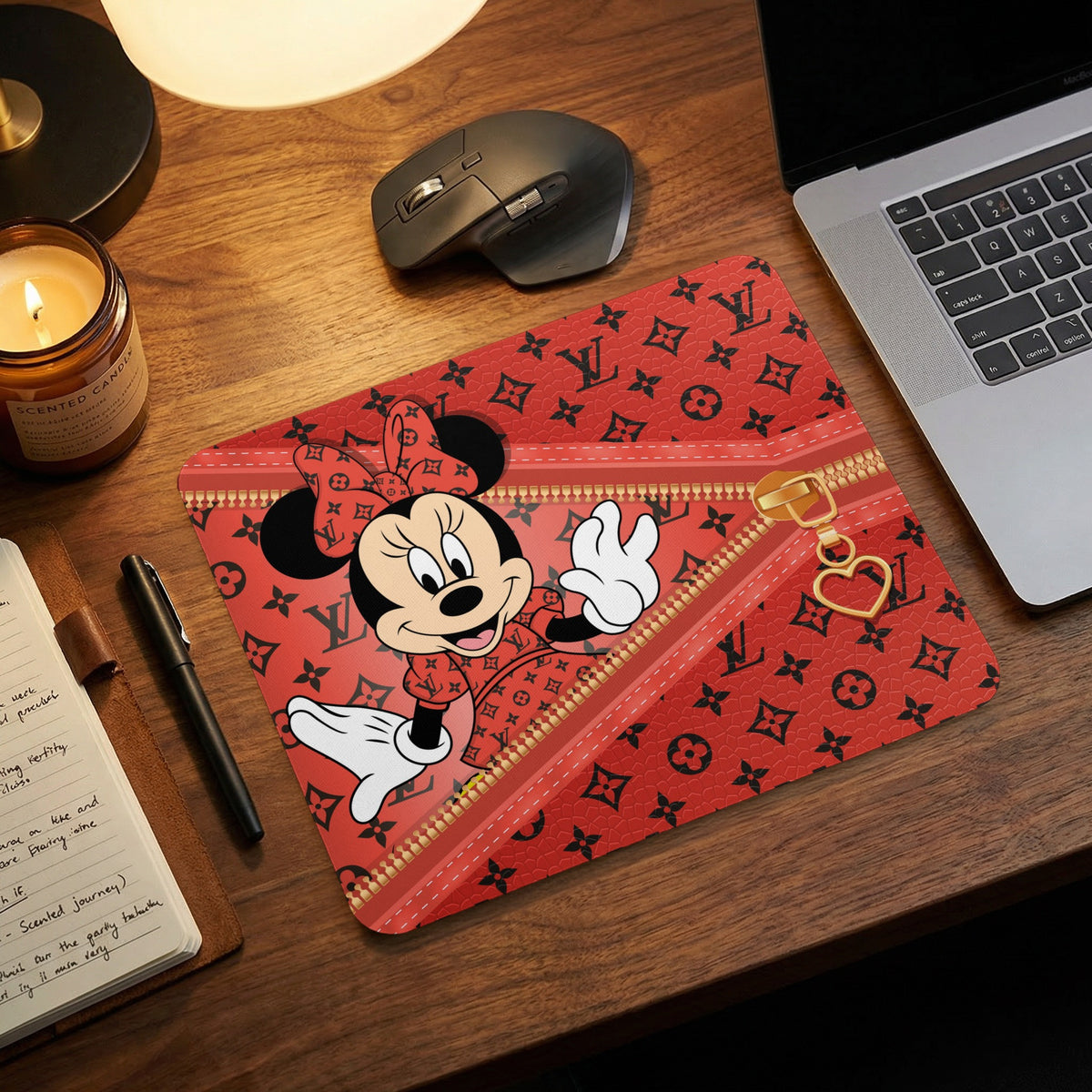 Minnie Mouse on a red mousepad with a black monogram print and gold zipper.