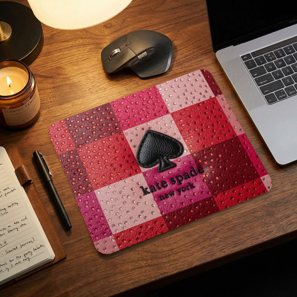 Kate Spade New York mousepad with pink and red checkered pattern and spade logo.