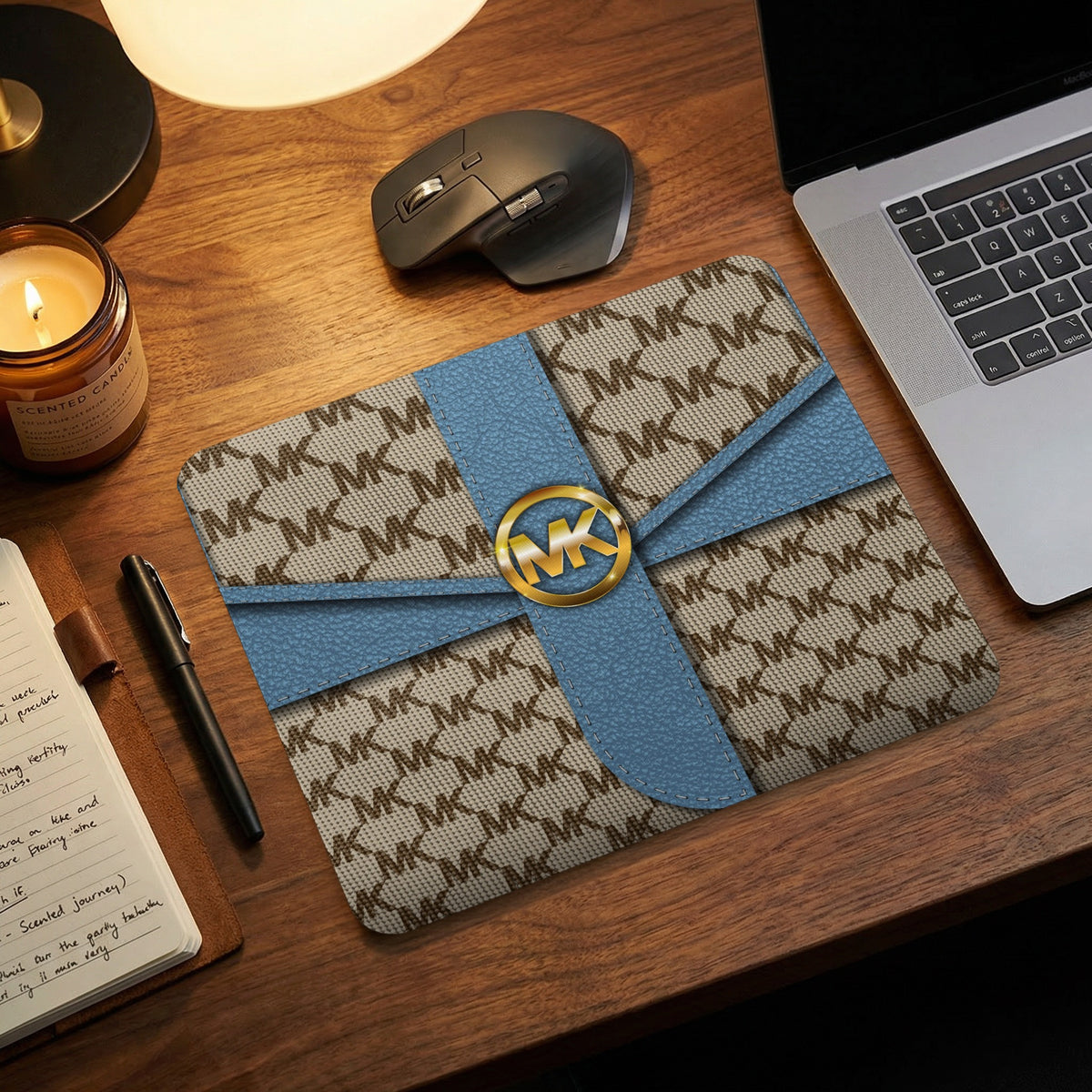 Michael Kors MK print laptop sleeve with blue ribbon and gold logo.
