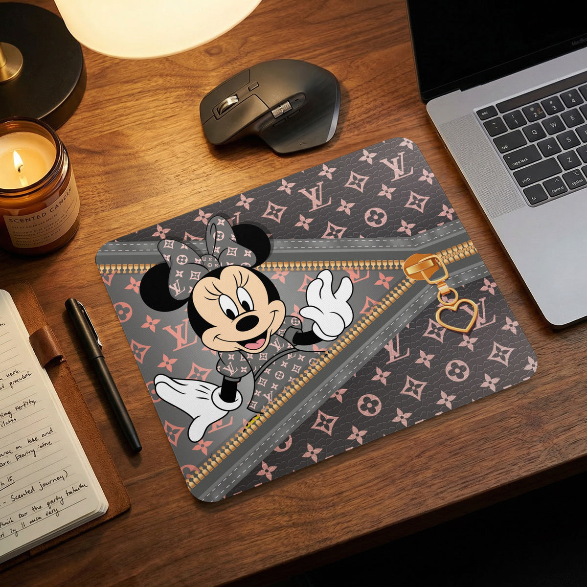 Minnie Mouse on a dark gray mousepad with pink Louis Vuitton pattern and gold zipper detail.