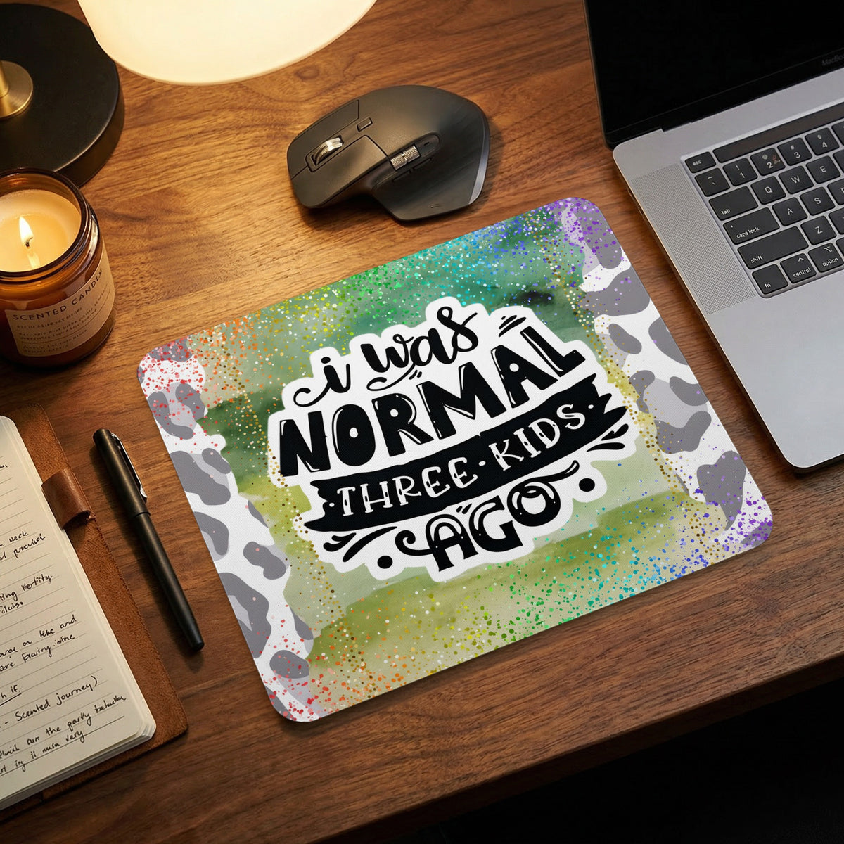 Mouse pad with a watercolor background and text reading I was normal three kids ago.
