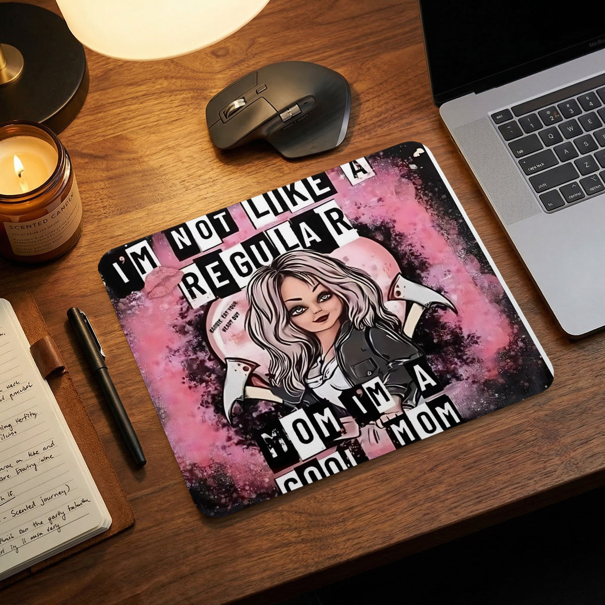 A rectangular mousepad featuring an illustrated gothic woman with pink hair and text reading I'M NOT LIKE A REGULAR MOM I'M A COOL MOM.