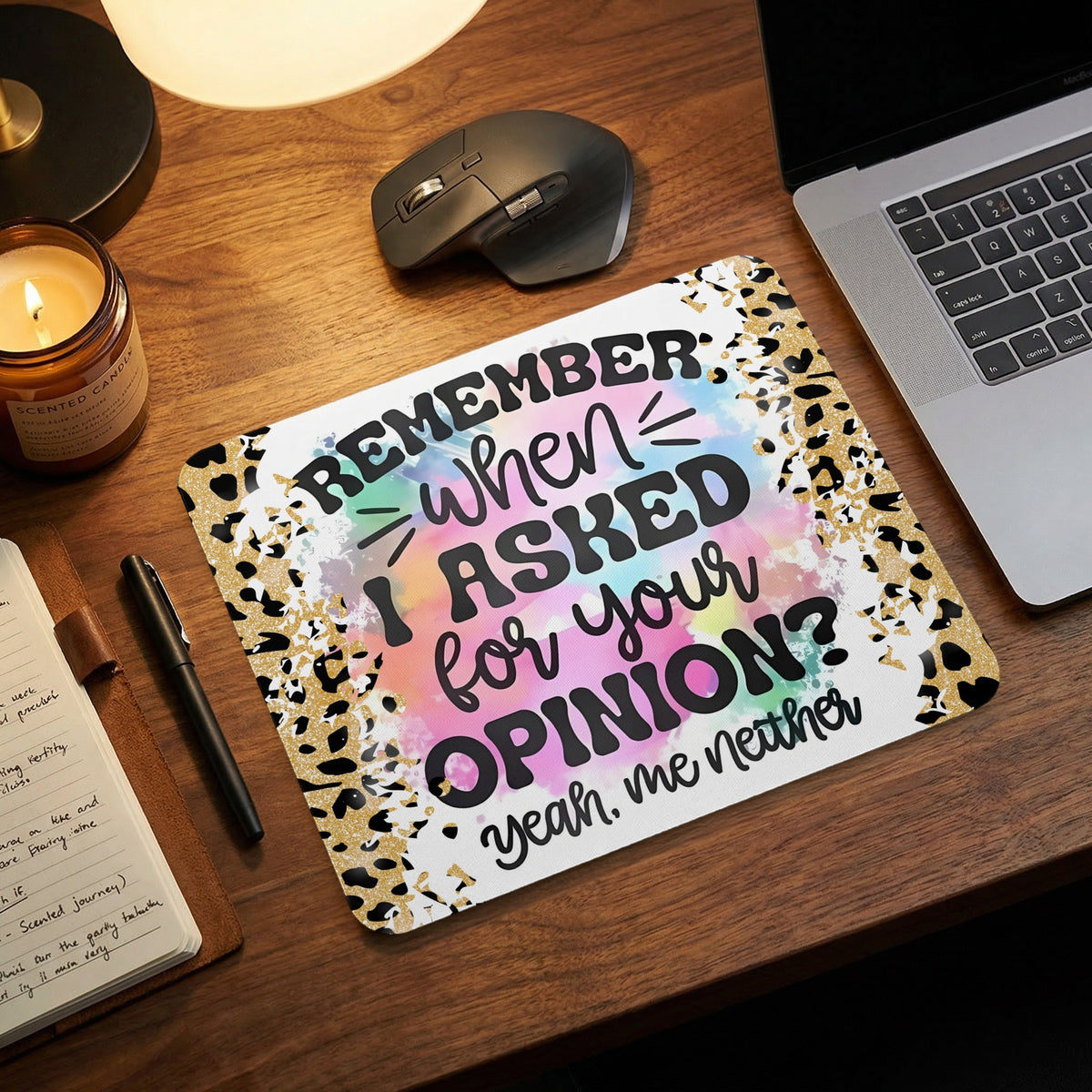 Mouse pad with leopard print borders and text reading Remember when I asked for your opinion yeah me neither on a desk.