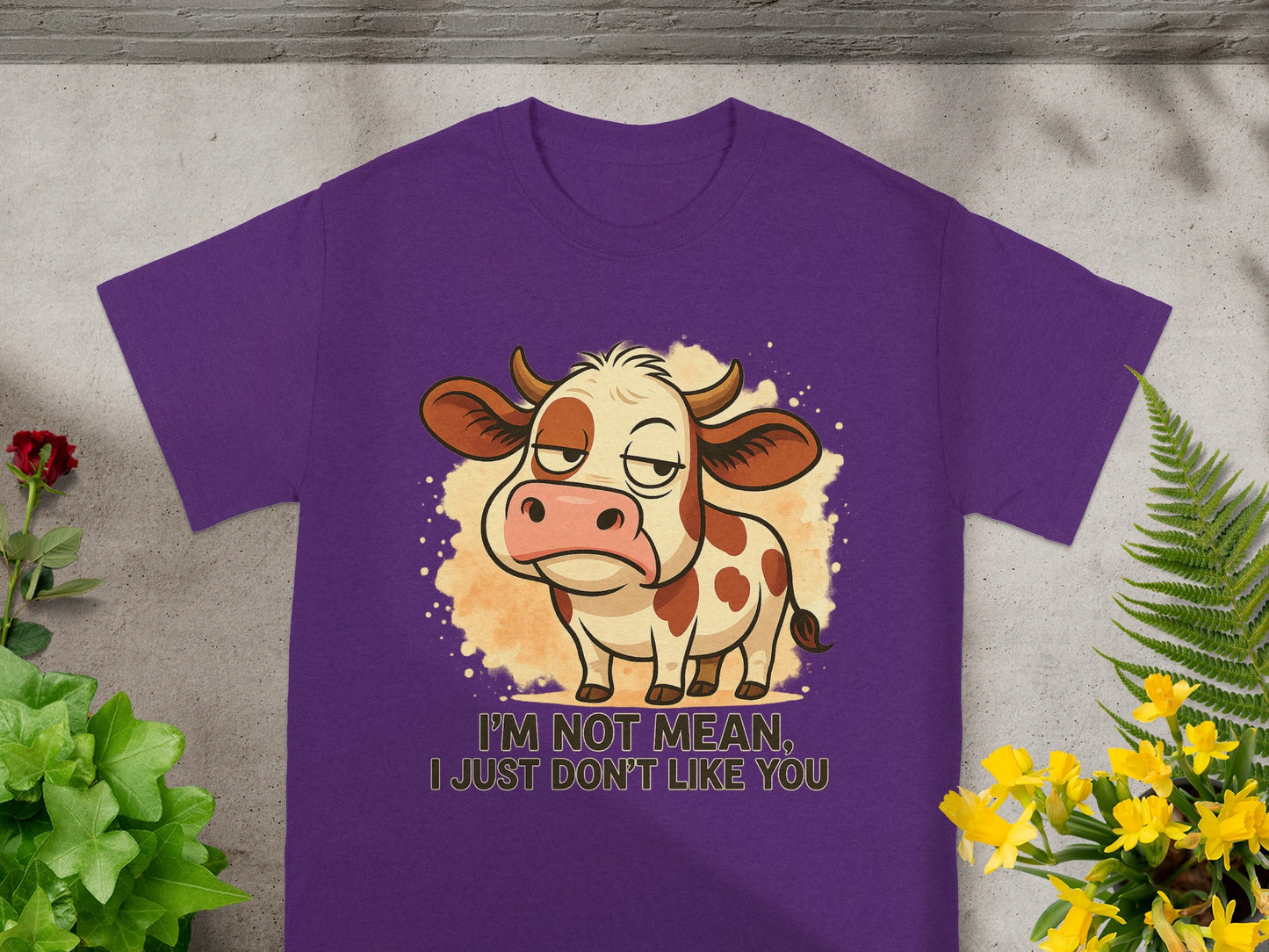 Purple t-shirt with a grumpy cartoon cow and the text "I'M NOT MEAN, I JUST DON'T LIKE YOU".