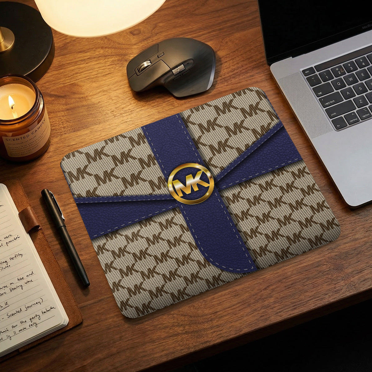 Mousepad with MK monogram pattern and blue ribbon detail.