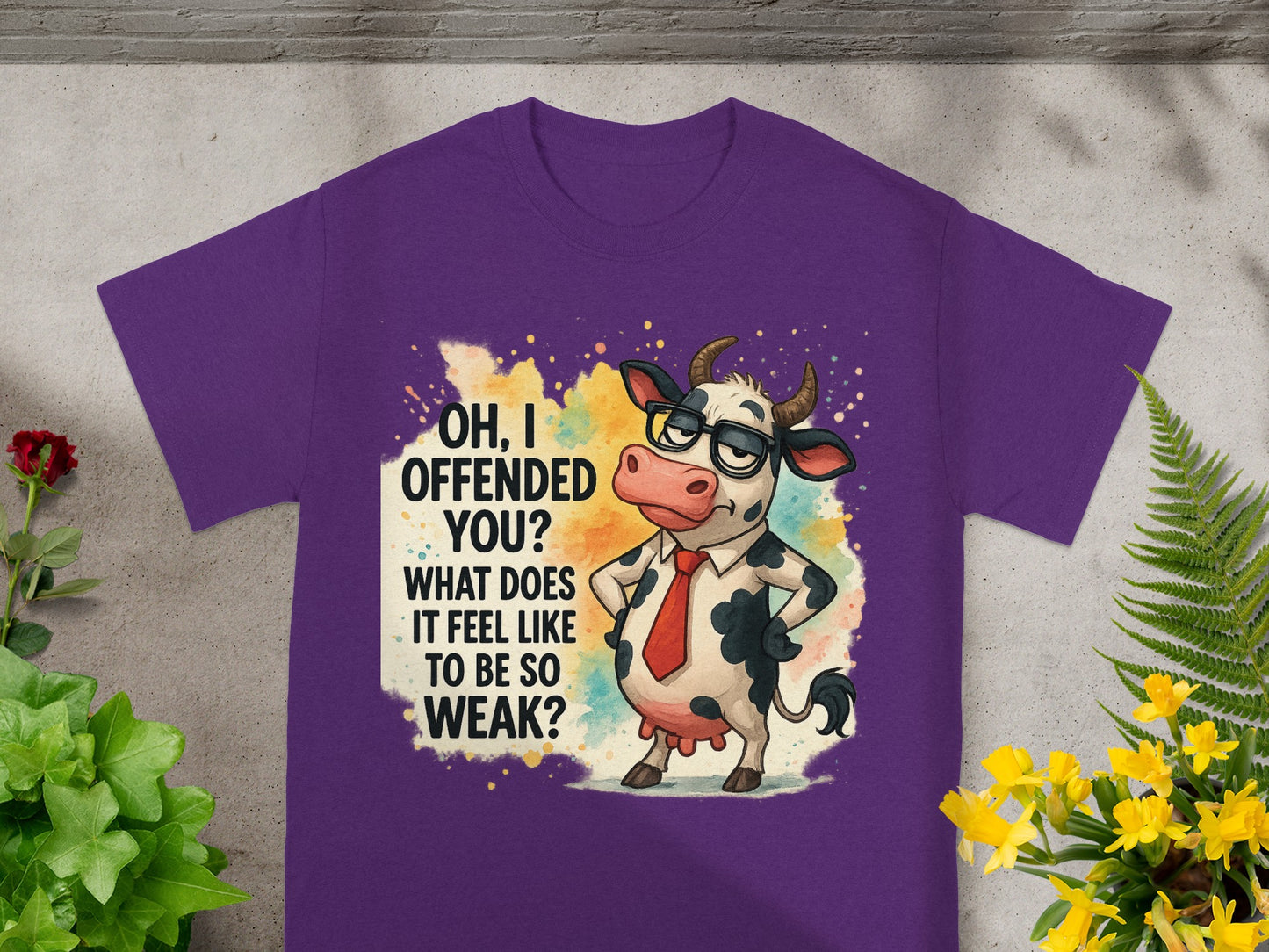 Purple t-shirt with a cartoon cow wearing glasses and tie, stating "OH, I OFFENDED YOU? WHAT DOES IT FEEL LIKE TO BE SO WEAK?".