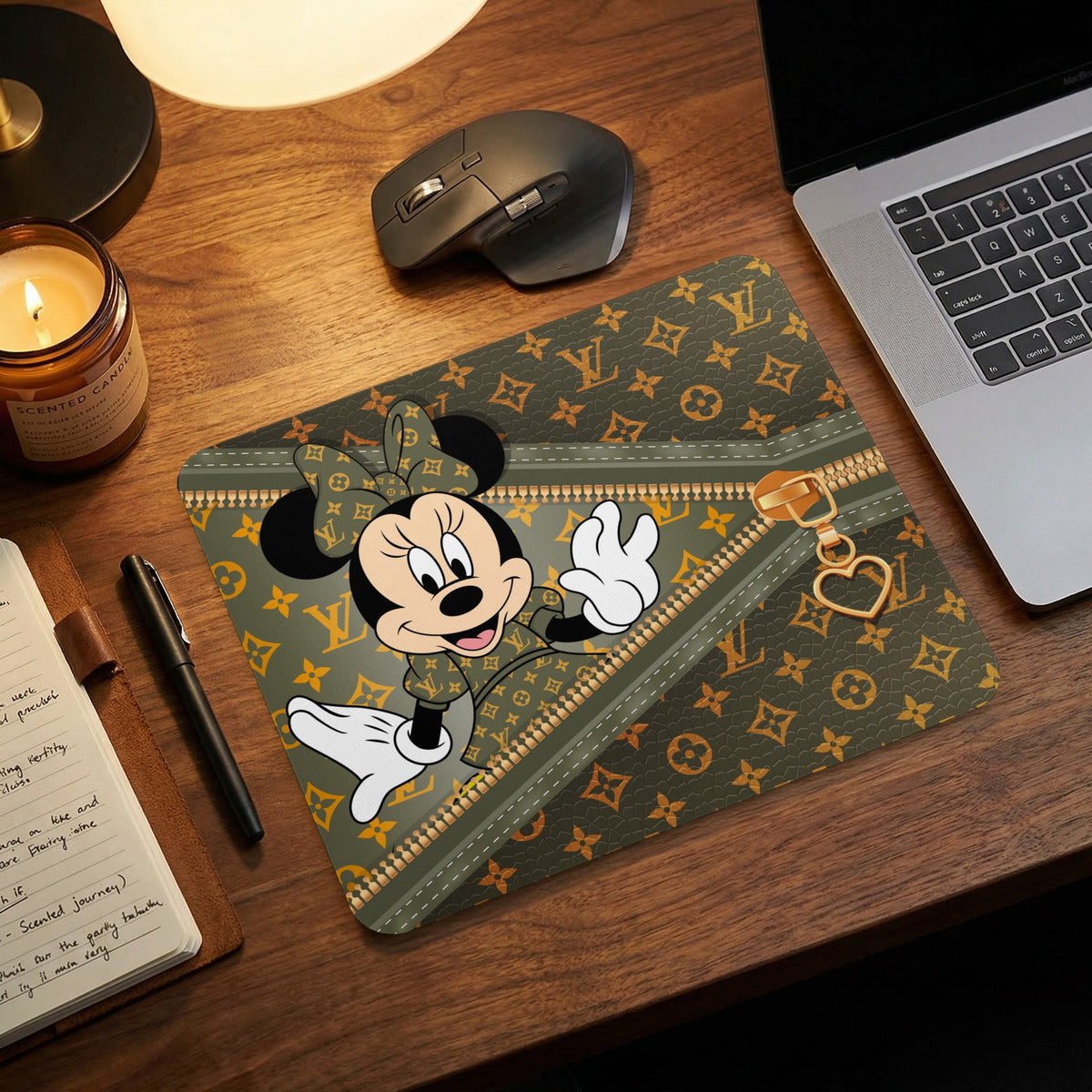 Minnie Mouse on a green mousepad with a faux zipper and monogram pattern.