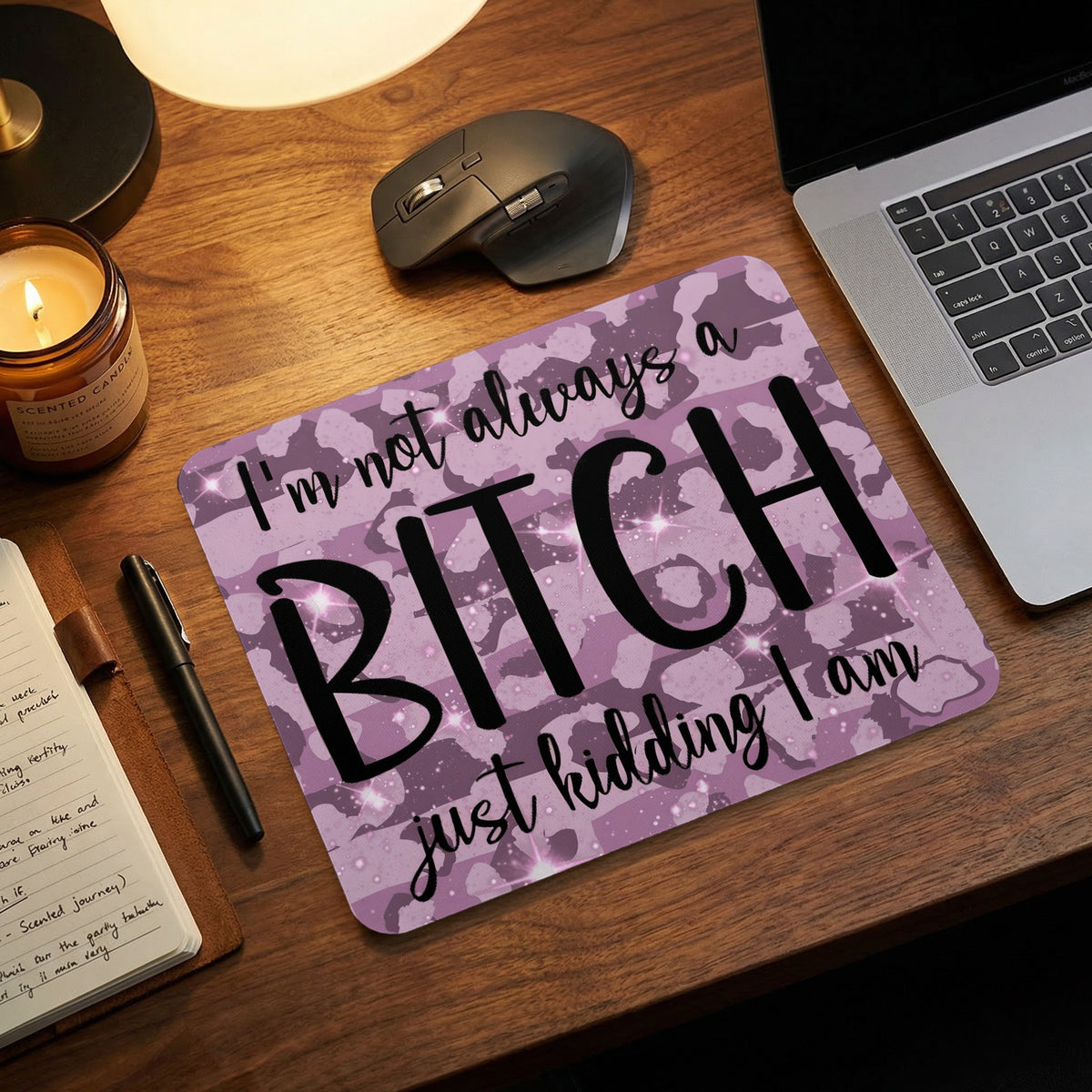 Purple camouflage mouse pad on a wooden desk with the text I am not always a bitch just kidding I am.