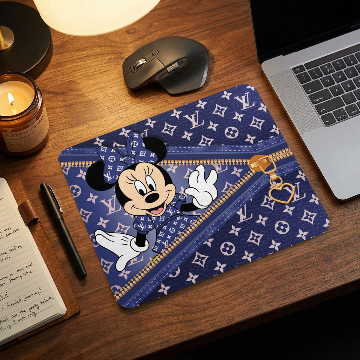 Minnie Mouse with a Louis Vuitton pattern mousepad on a desk.
