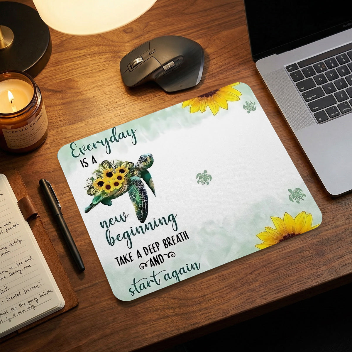 Mousepad with a turtle, sunflowers, and the text "Everyday is a new beginning".