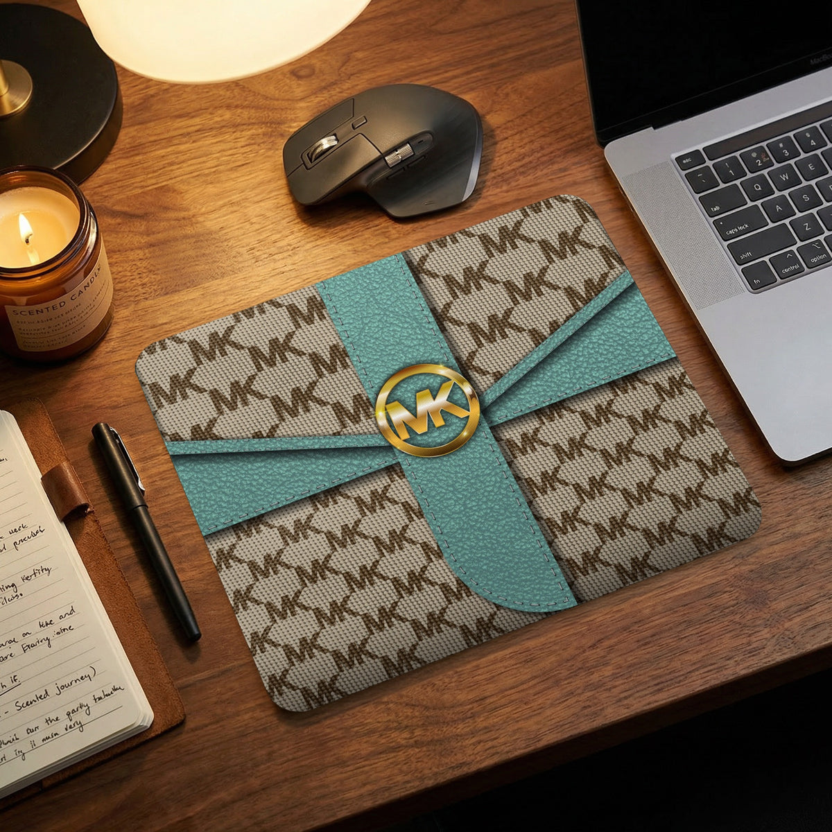 Michael Kors MK print mousepad with teal ribbon and gold logo.