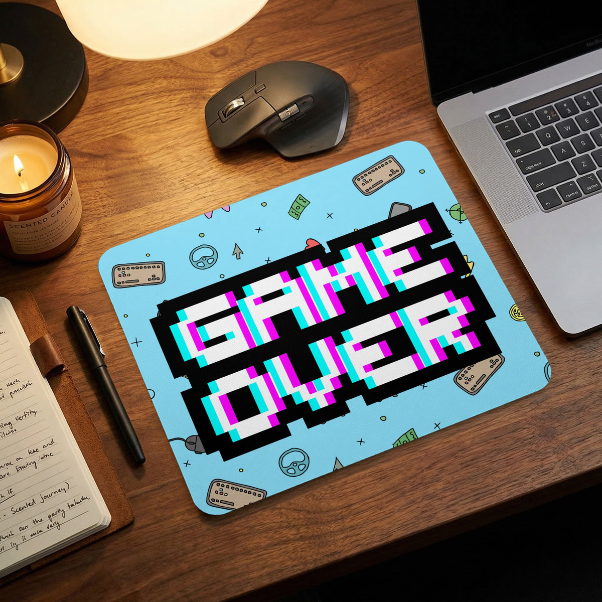 A light blue mousepad featuring pixelated black text that reads GAME OVER with cyan and magenta outlines.