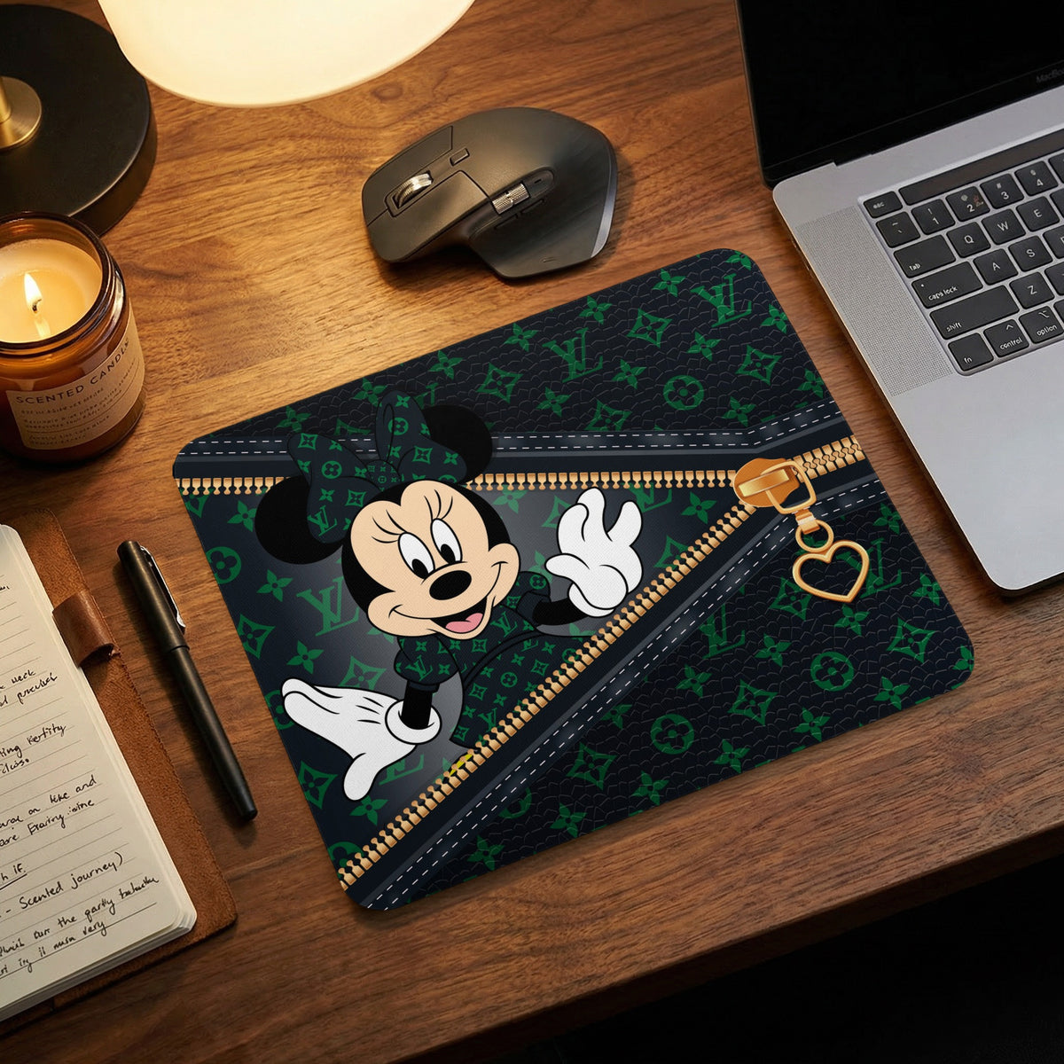 Minnie Mouse on a dark green patterned mousepad with a gold zipper and heart charm.