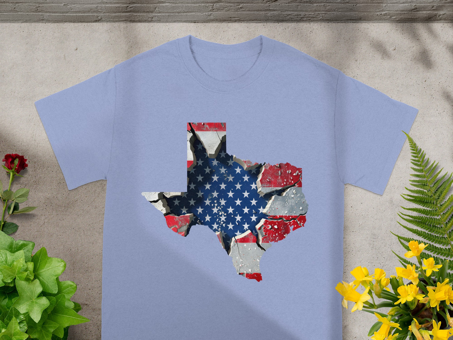 Light purple t-shirt with a cracked Texas outline filled with the American flag.