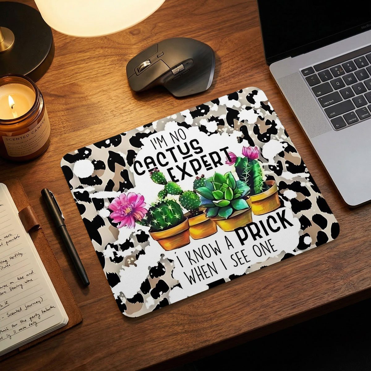 Cowprint mousepad featuring potted cacti and the humorous text, I am no cactus expert, I know a prick when I see one.