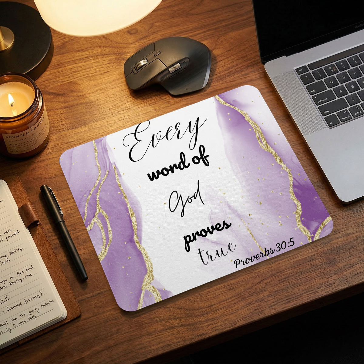 A purple and gold marble-patterned mouse pad inscribed with the quote "Every word of God proves true Proverbs 30:5."