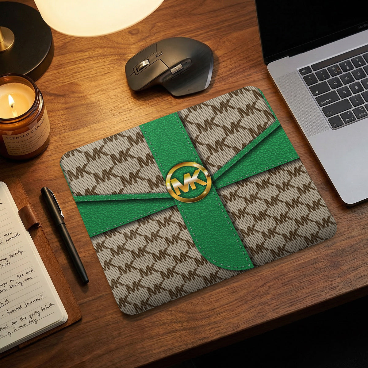 Michael Kors monogram mousepad with green ribbon detail and gold logo.