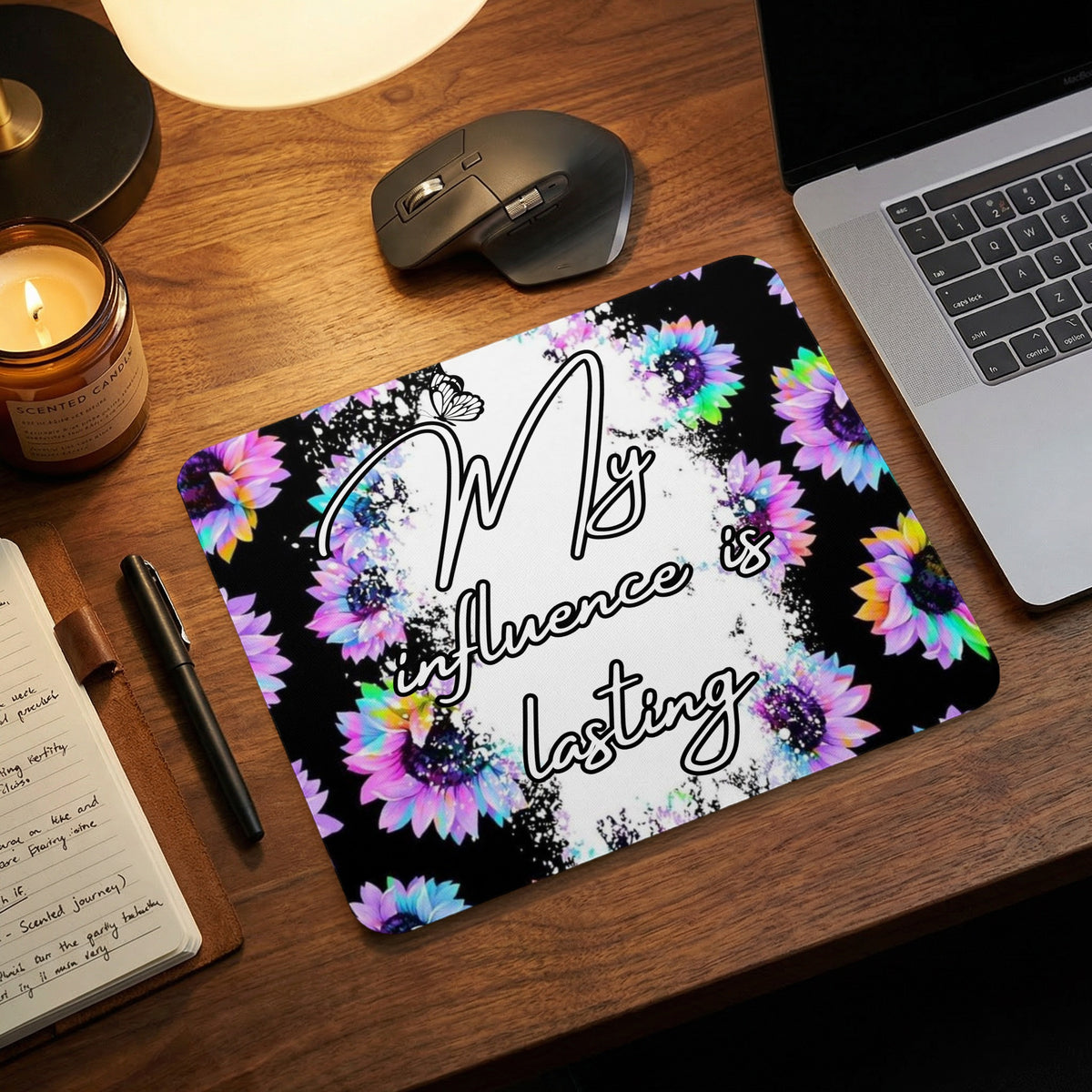 Mousepad with colorful sunflowers and the text "My influence is lasting".