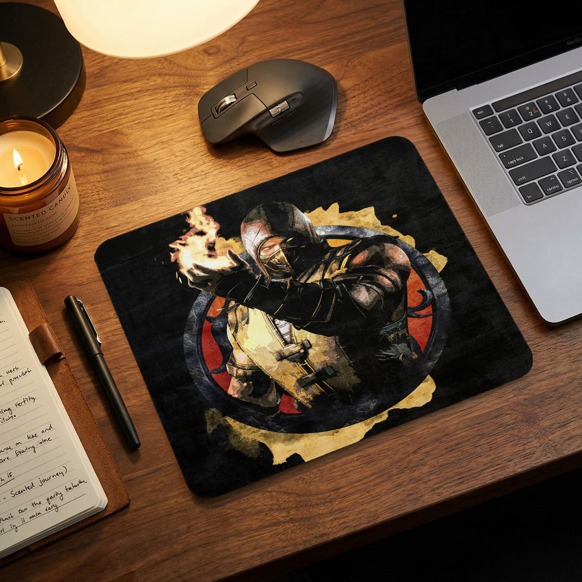 A rectangular gaming mouse pad featuring a graphic of Scorpion from Mortal Kombat holding fire on a wooden desk.
