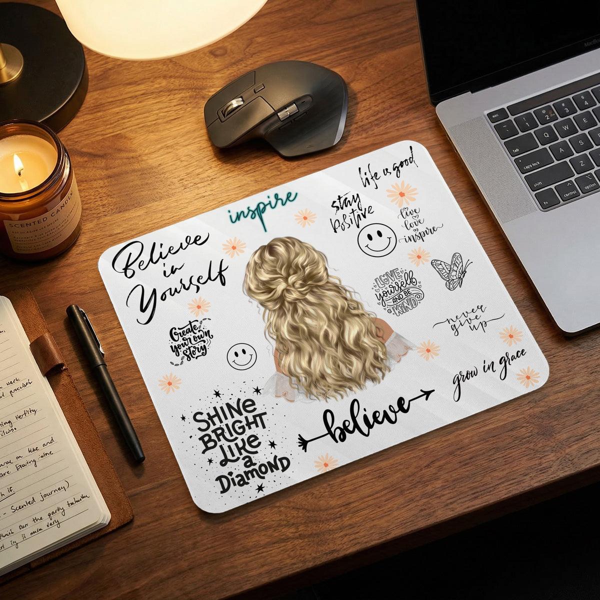 Mousepad with inspirational quotes and illustration of a woman with blonde hair.