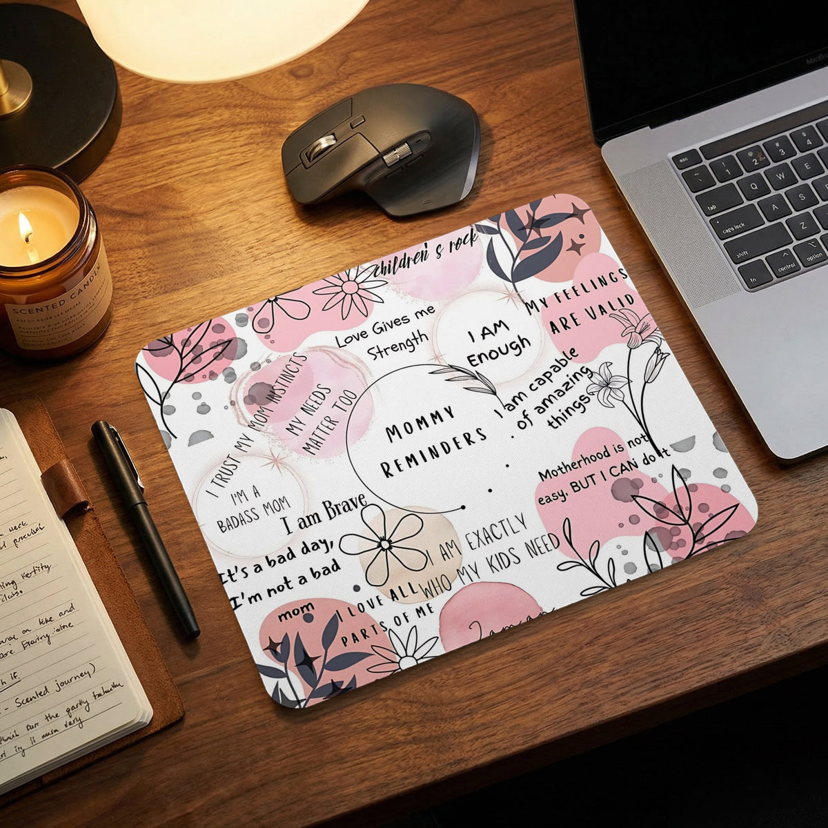 Mousepad with "Mommy Reminders" text and floral designs.