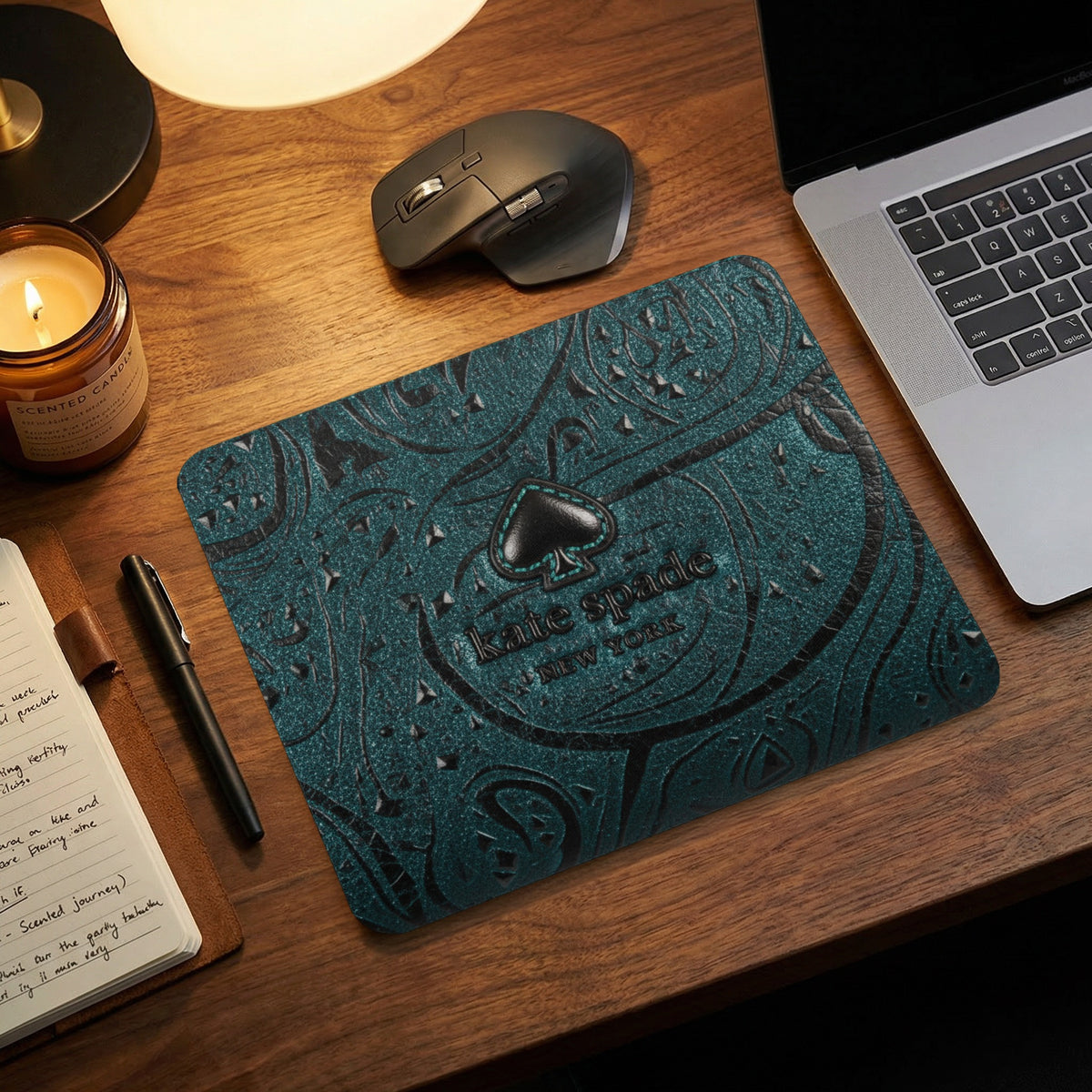 Kate Spade New York teal paisley mousepad with embossed spade logo.