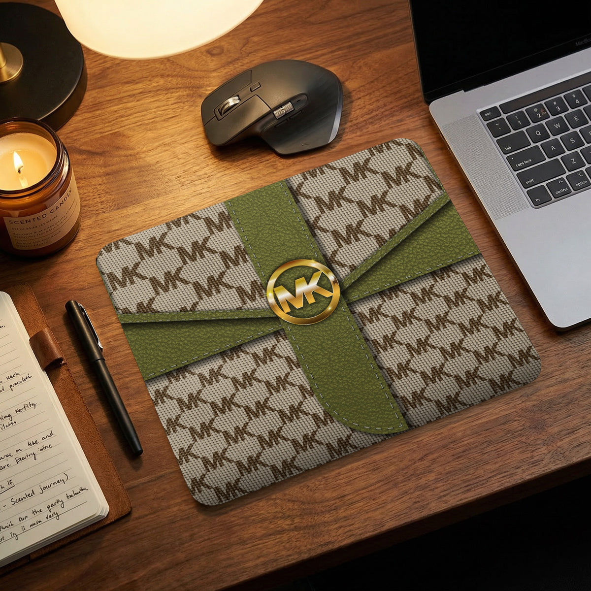 Michael Kors patterned mousepad with gold logo on desk.