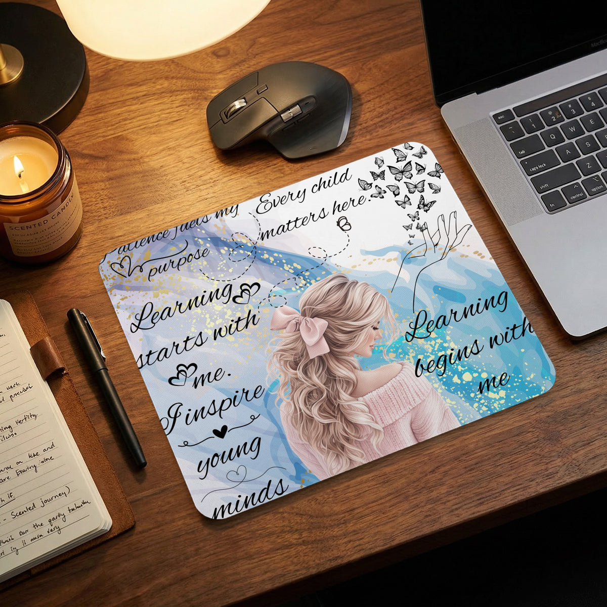 Mousepad with illustration of a woman and inspirational quotes about learning and children.