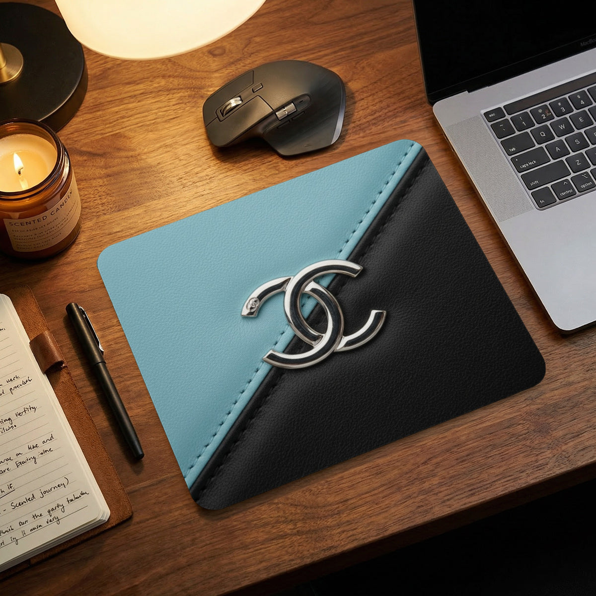 Mousepad with blue and black sections and silver interlocking Cs logo.
