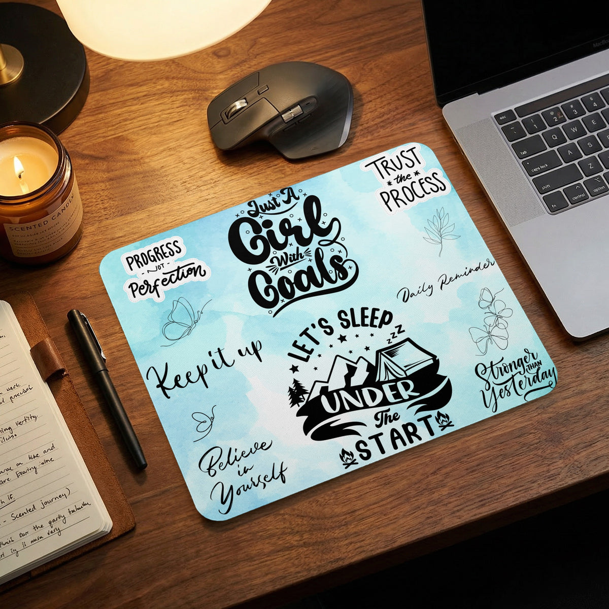 Mousepad with light blue watercolor background and motivational text and graphics.