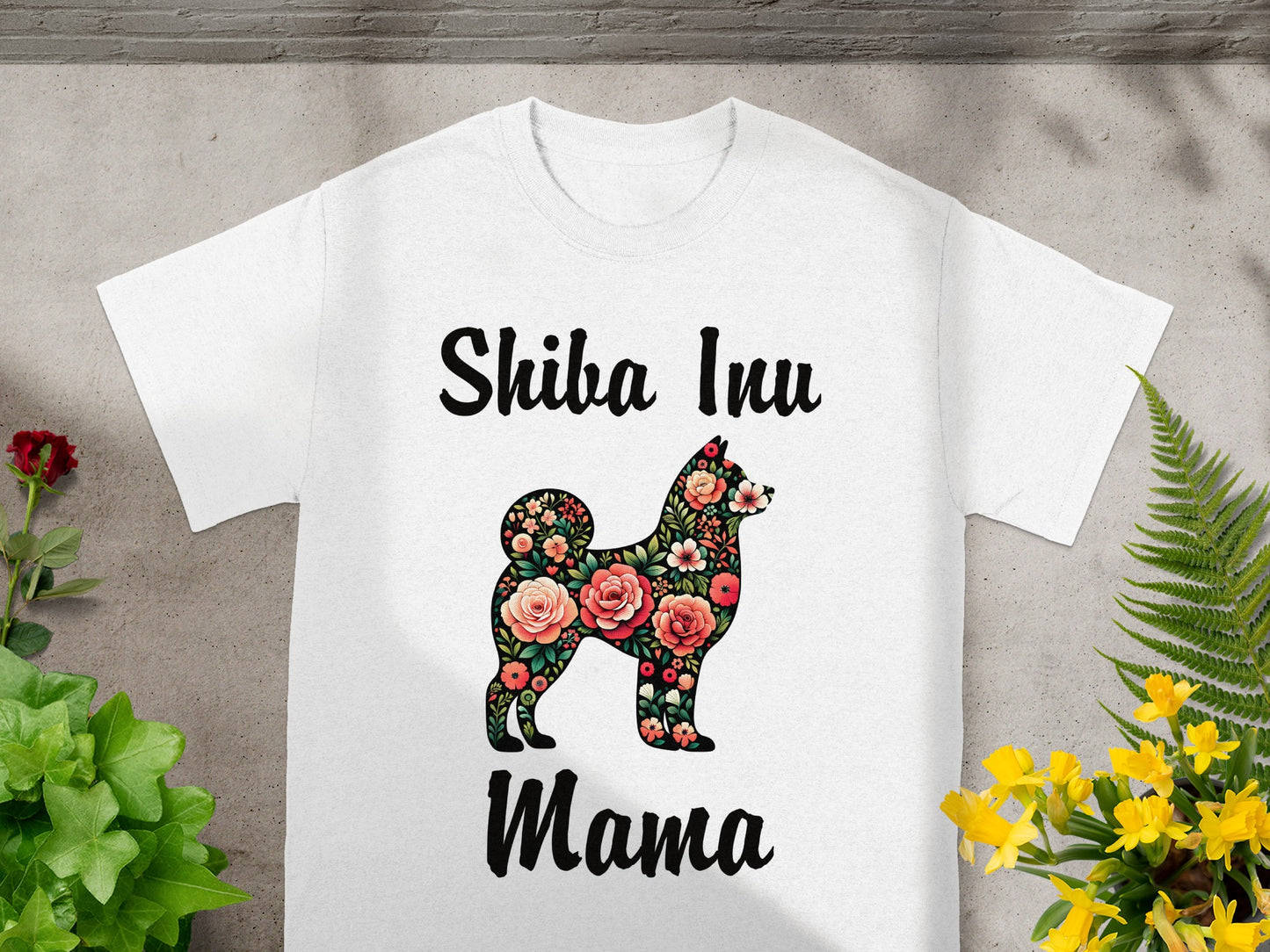 White t-shirt with "Shiba Inu Mama" text and floral Shiba Inu silhouette.