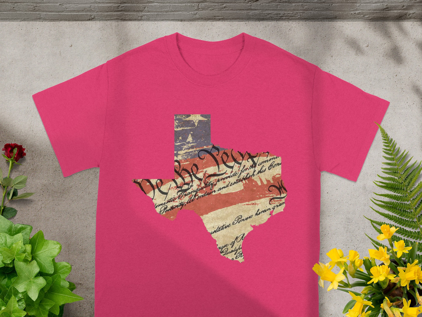 Pink t-shirt with Texas silhouette featuring distressed US flag and historical text on the chest.