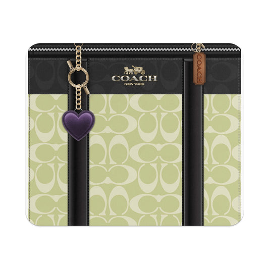 Coach signature pattern wallet with heart and horse carriage logos.