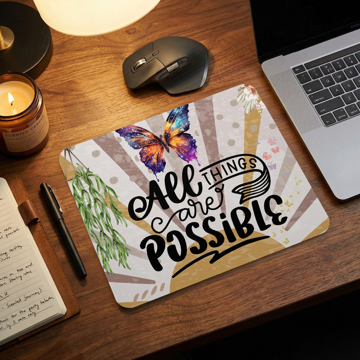 Mousepad with colorful butterfly and "All Things Are Possible" text.