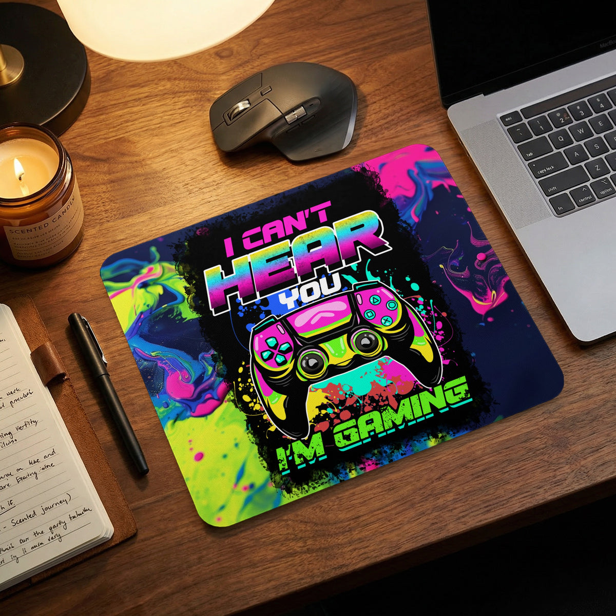 A colorful gaming mousepad featuring a controller and text reading I can't hear you I'm gaming.