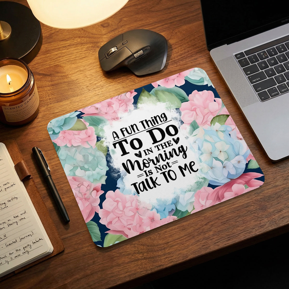 Mousepad with pink and blue flowers and text "A fun thing to do in the morning is not talk to me."