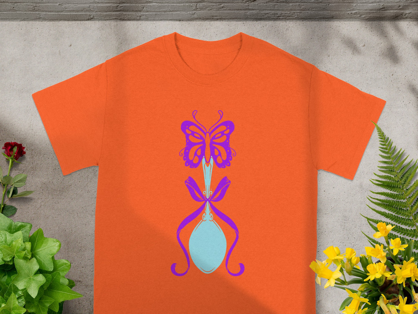 Orange T-Shirt with Blue Butterfly and Bow Design