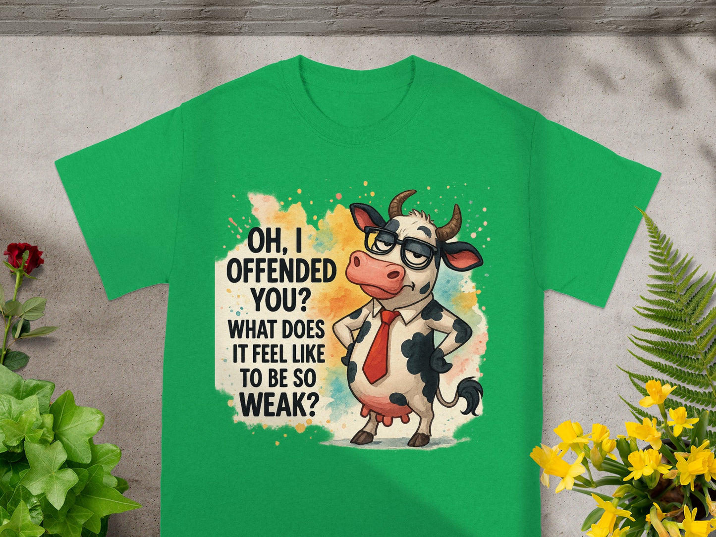 Green t-shirt with cartoon cow and text "Oh, I offended you? What does it feel like to be so weak?"