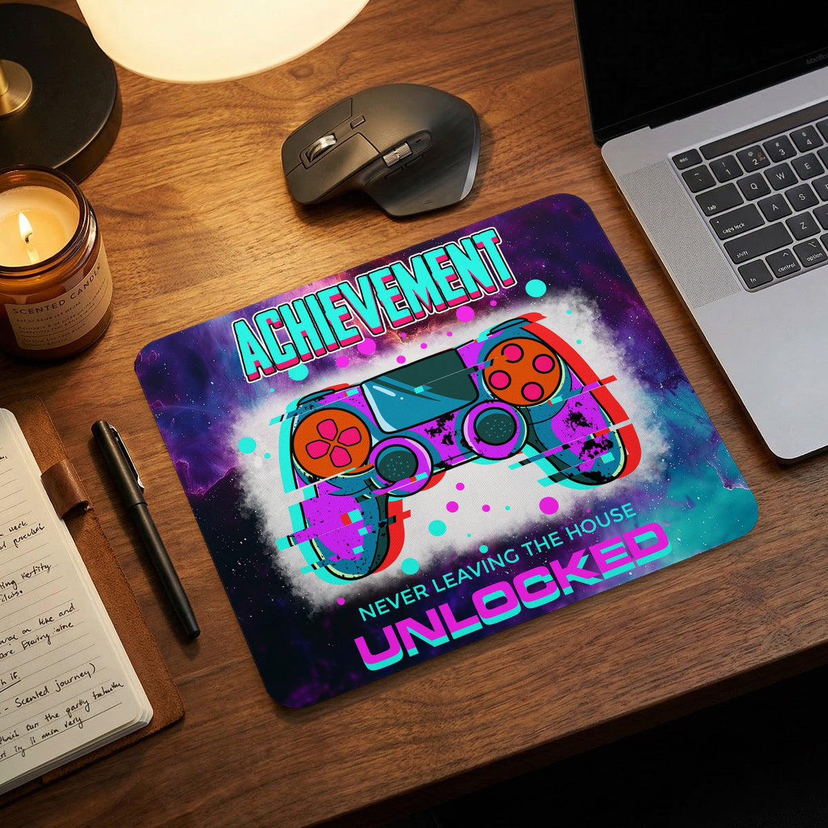 Rectangular mousepad with a cosmic design, glitch-effect controller, and text reading Achievement Never Leaving the House Unlocked.