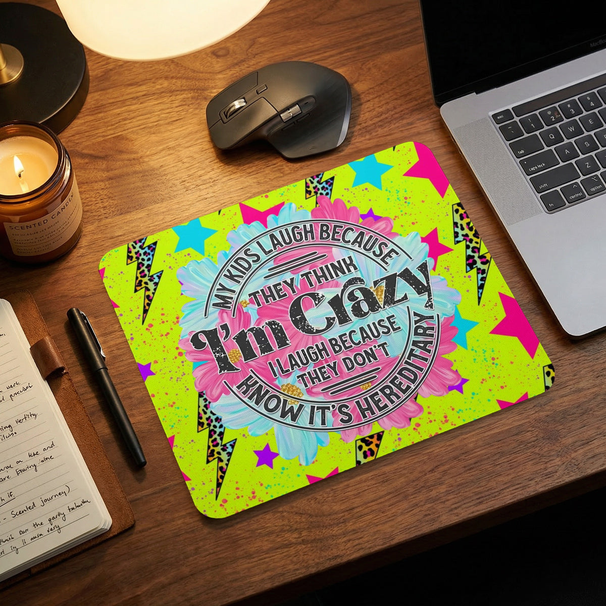 Neon green mousepad featuring the text My kids laugh because they think I am crazy, I laugh because they know it is hereditary.