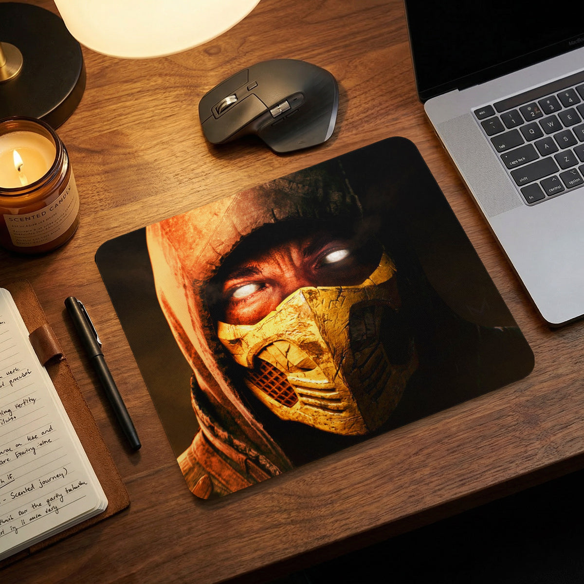 Scorpion from Mortal Kombat printed on a rectangular mouse pad on a wooden desk.