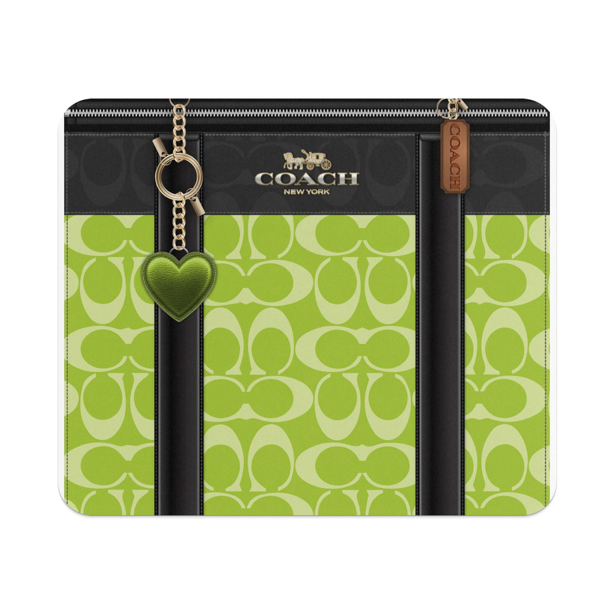Coach bag with green heart charm and signature logo pattern.