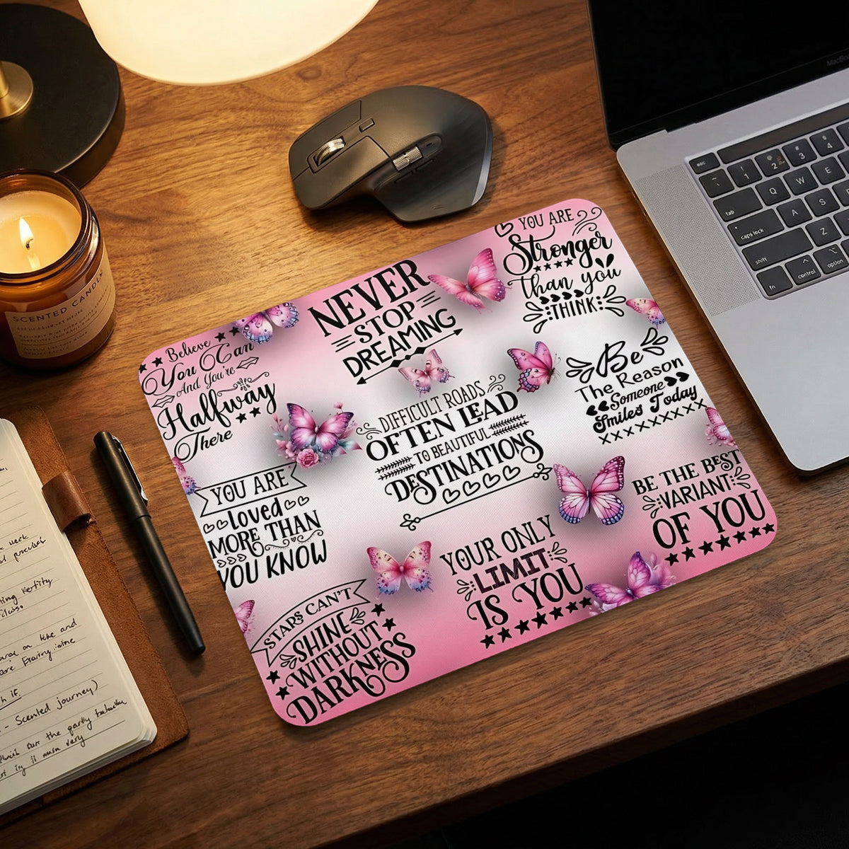 Pink mousepad with butterflies and inspirational quotes.