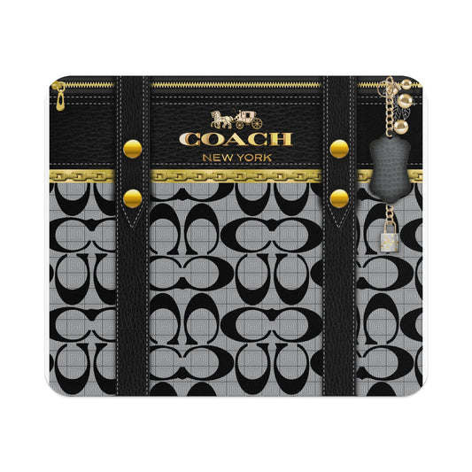Coach pattern case with gold zipper, chain detail, and horse and carriage logo.