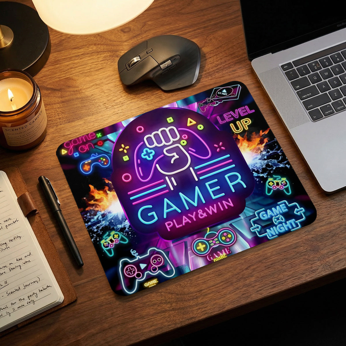 A gaming mouse pad featuring a neon design with controllers, fire, and the text "Gamer Play & Win."