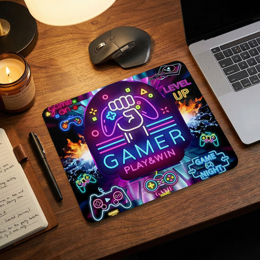 A gaming mouse pad featuring a neon design with controllers, fire, and the text "Gamer Play & Win."