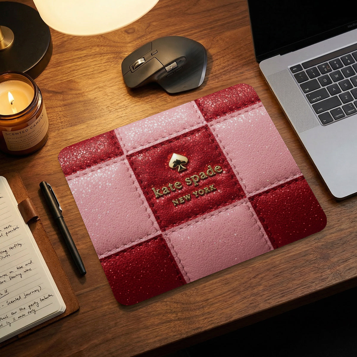 Kate Spade New York mousepad with pink and red checkerboard design.